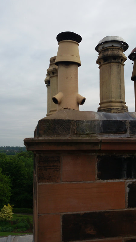 the view of chimney stacks of stately home