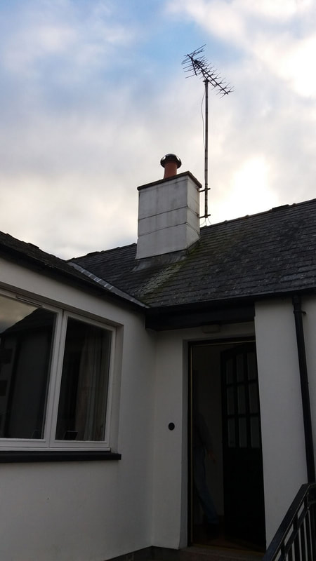 a view up onto the roof where the chimney pot is to be replaced